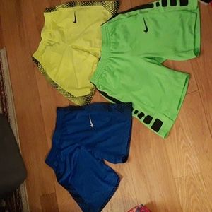 Boys Nike Shorts-3 Pairs. 1-Green/Black, 1-Yellow/Black, 1 Blue/Black. Size L.